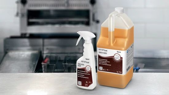 Keystone Oven & Grill and Oven & Grill Spray say on kitchen worksurfaces with grill in the background